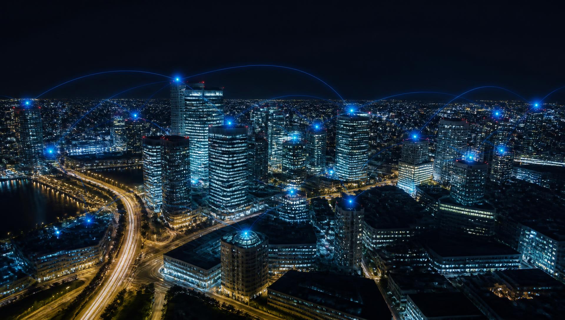 Aerial view of a city at night with streams of light representing customer calls